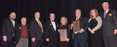 Barbara Benham and Brad Long receive the "Captains Award"